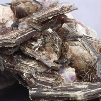 Specimen measures approx. 3.5 in. and each section measures approx 1 in. side to side. Common Mica. Muscovite has a layered structure of aluminum silicate sheets weakly bonded together by layers of potassium ions. Muscovite sheets were used for kitchen oven windows before synthetic materials replaced them.